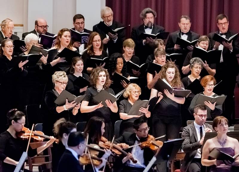 Close up of the chorus and orchestra in concert